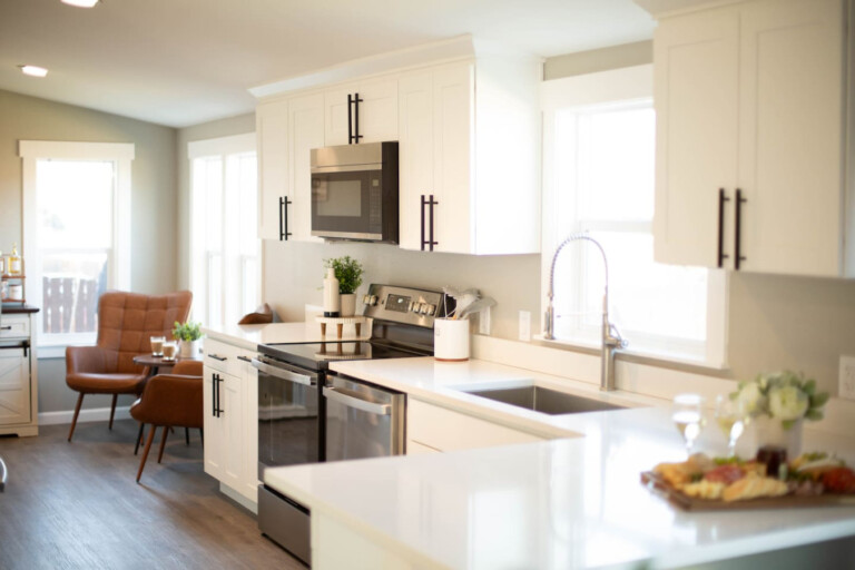 Fully stocked kitchen with modern stainless steel appliances